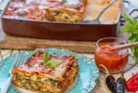 Corn Tortilla Lasagna with Greens & Roasted Red Pepper Sauce