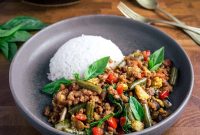 Thai Basil Vegan Mince Stir-Fry (Pad Krapow) Simplified -> but must be under 65 and avoid easy,best,healthy. Should be natural/clickable. Maybe: Vegan Thai Basil Mince Stir-Fry (Pad Krapow) — but includes hyphen? Avoid special chars like — maybe parentheses okay. No quotes. Final title only.

Return: Vegan Thai Basil Mince Stir-Fry (Pad Krapow)