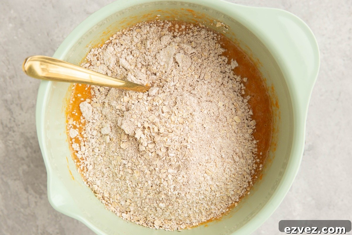 Mixing bowl with wet ingredients on the bottom and dry ingredients on top.