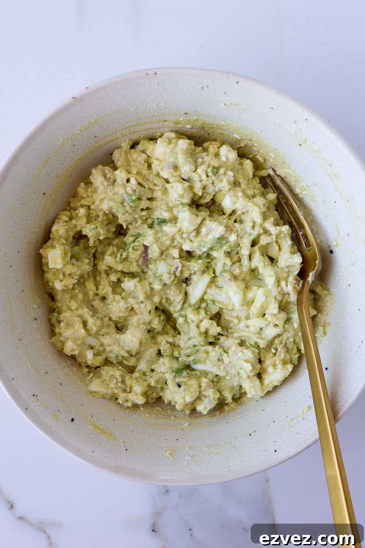 Cottage cheese avocado mash in a bowl.