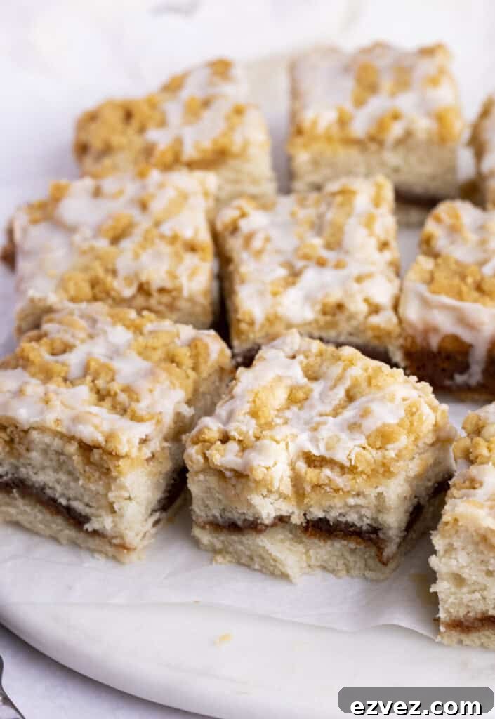 Vegan Coffeecake with Cinnamon Streusel Topping 3 Squares of vegan coffee cake on a white plate