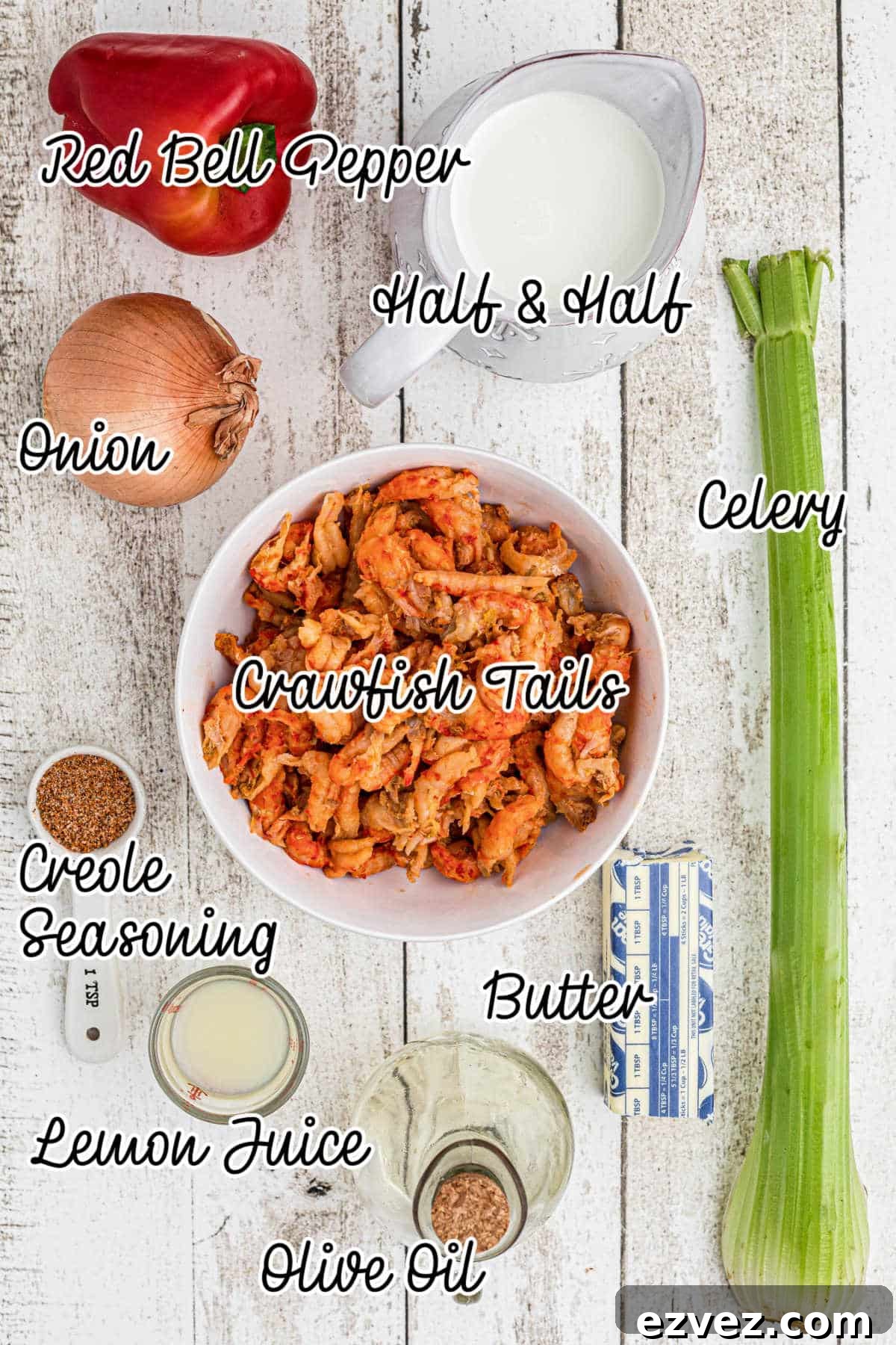 Ingredients laid out with text overlay, showing what is used to make a crawfish sauce.