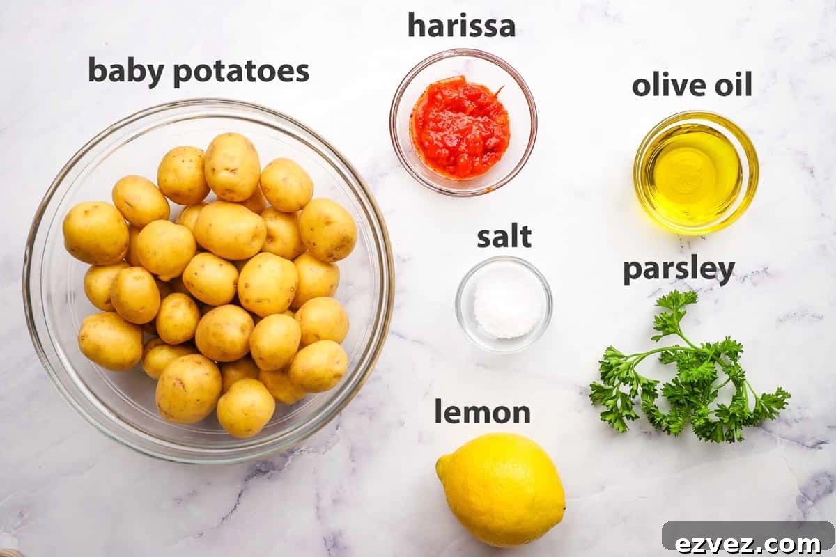 ingredients pictured and labelled for harissa potatoes