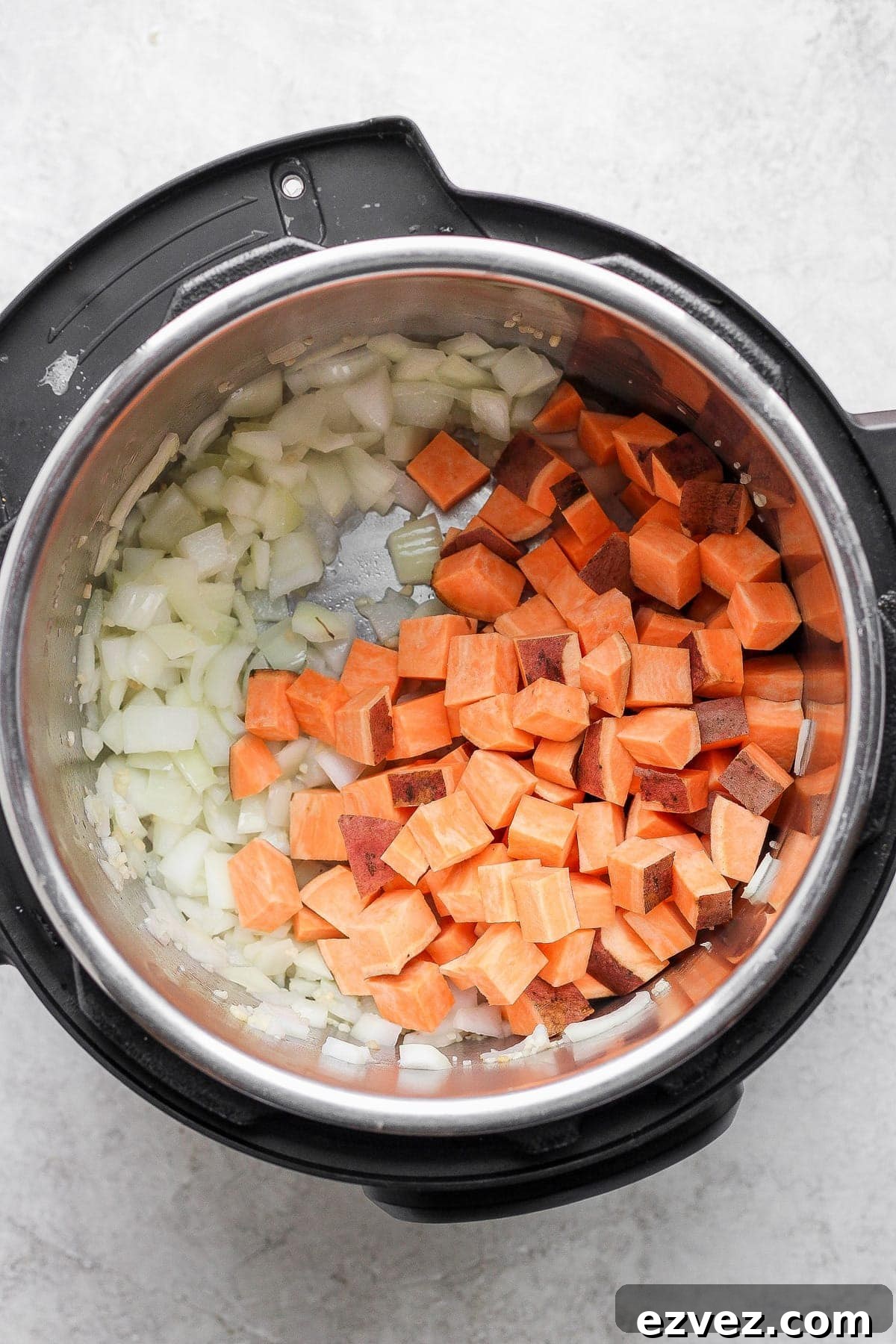 Sweet potatoes and onion in an Instant Pot. 