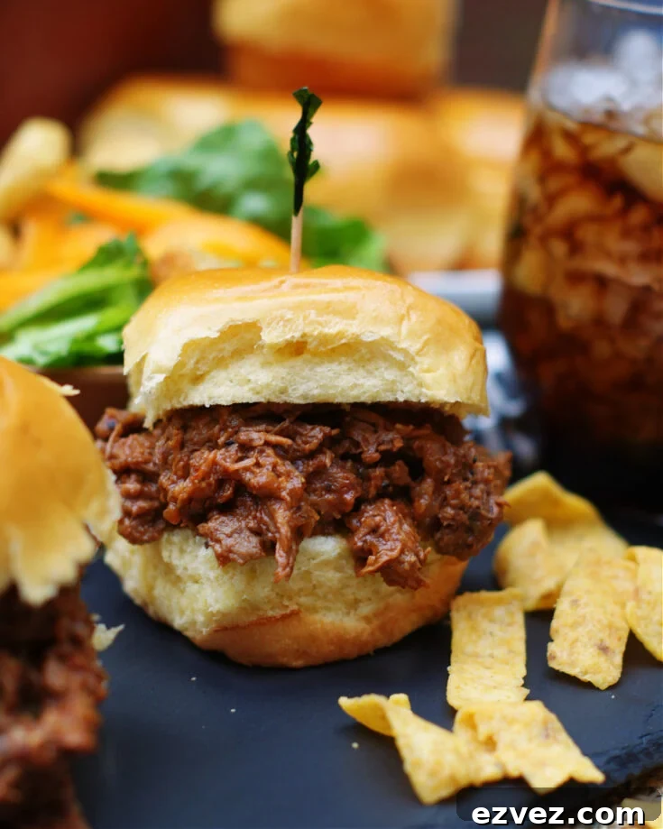 shredded chuck roast cooked in homemade tangy and sweet bbq sauce in the crock pot for sandwiches or as a main dish