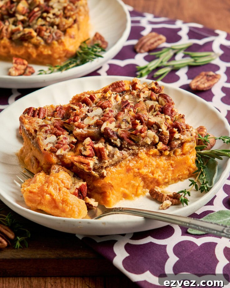 A forkful of sweet potato casserole to show the fluffy texture of the potatoes.