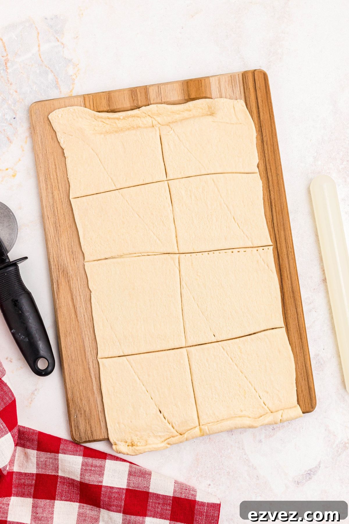 Crescent dough rolled out and cut into 8 squares.