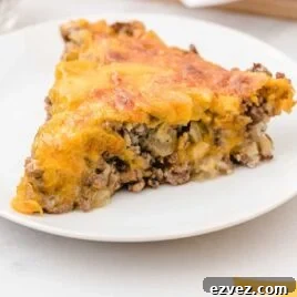 a slice of Cheeseburger Pie on a plate