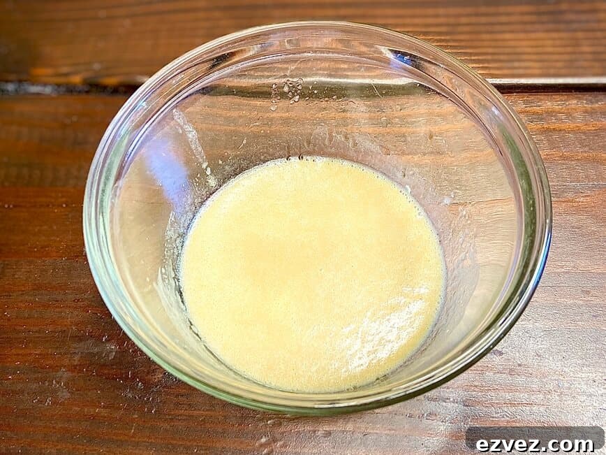Classic Creamy Caesar Dressing Recipe 4 Mixing lemon, olive oil, mustard, Worcestershire, and mayonnaise in a bowl.