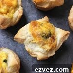 Horizontal image of mini quiches on a slate.