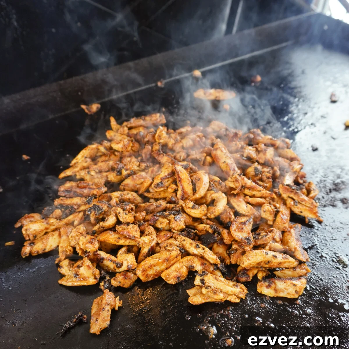 Authentic Grilled Chicken Shawarma Recipe for Flavorful Meals 8 grilled chicken shawarma on a griddle.