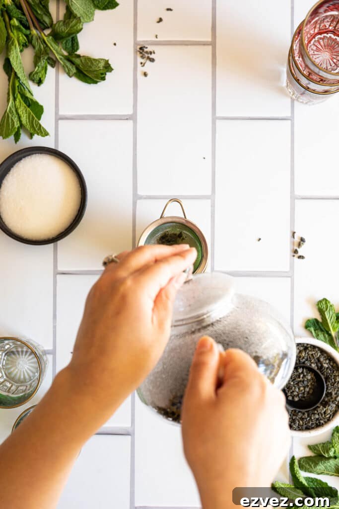 two hands pouring tea