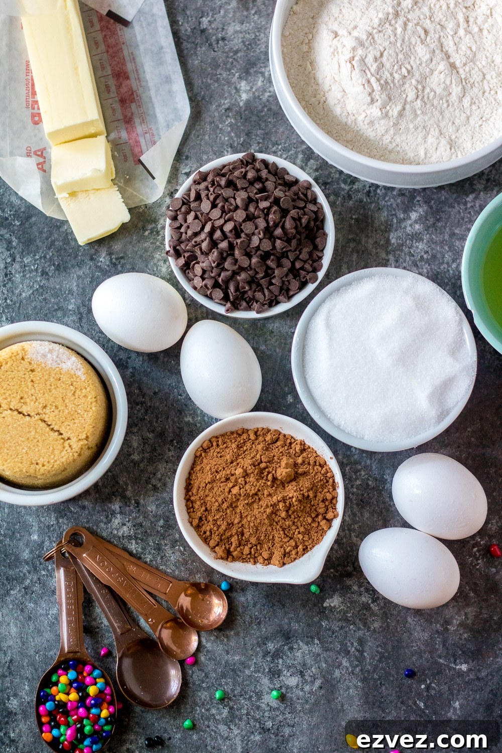 Cosmic Brownies Recipe — Fudgy, No-Bake Chocolate Squares 3 all ingredients for the cosmic brownie recipe on a grey cutting board