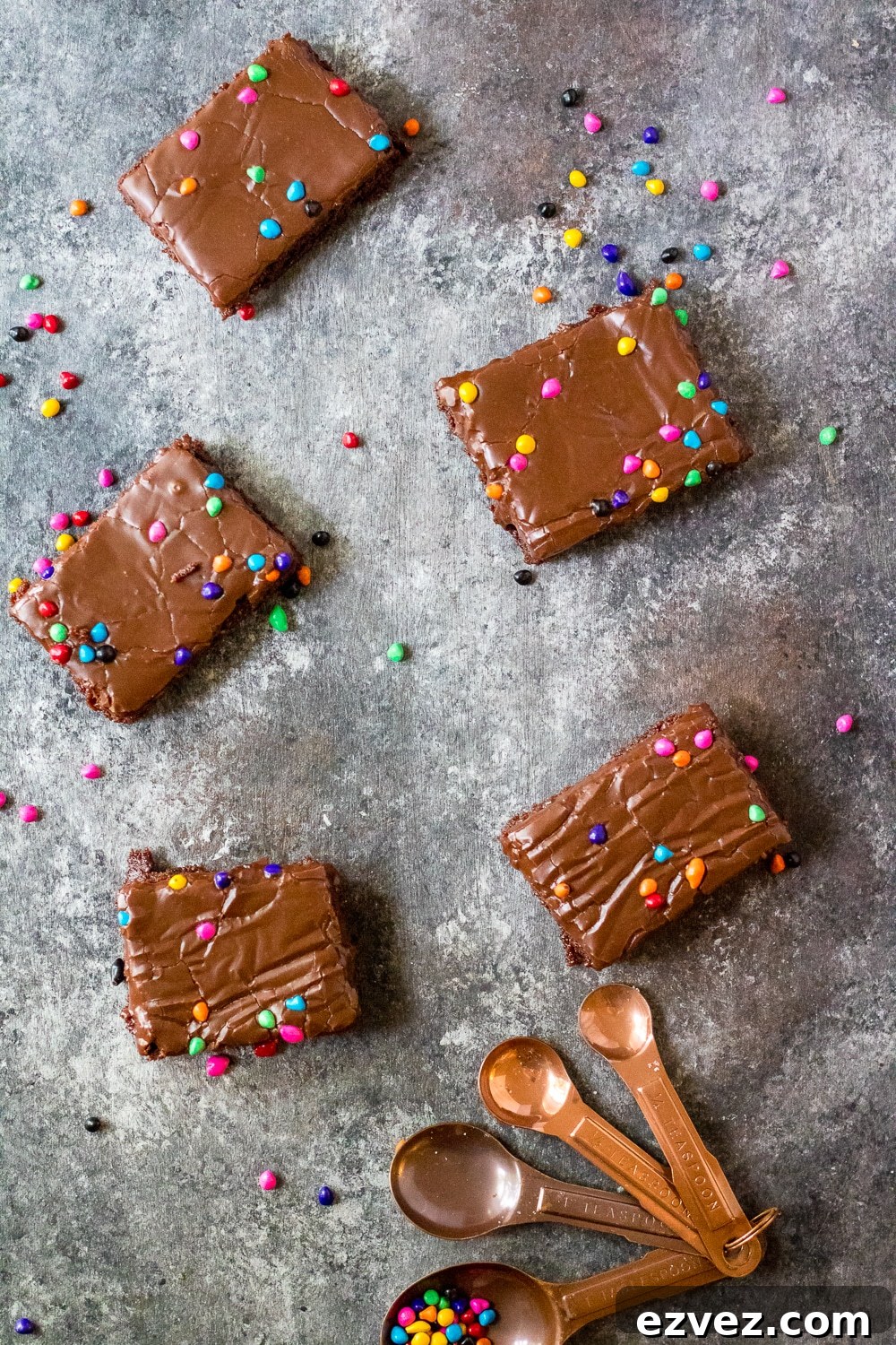 Cosmic Brownies Recipe — Fudgy, No-Bake Chocolate Squares 7 cosmic brownies on a grey cutting board
