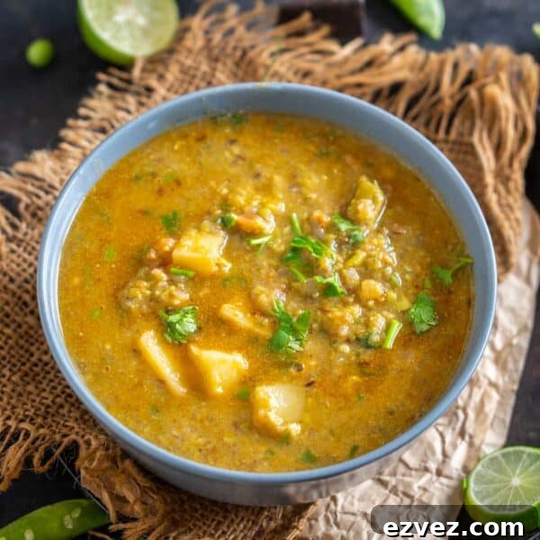 A blue bowl filled with Matar ka Nimona, garnished with fresh cilantro.