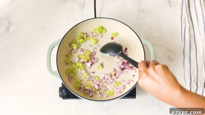 Sauteeing onions and celery in a pot