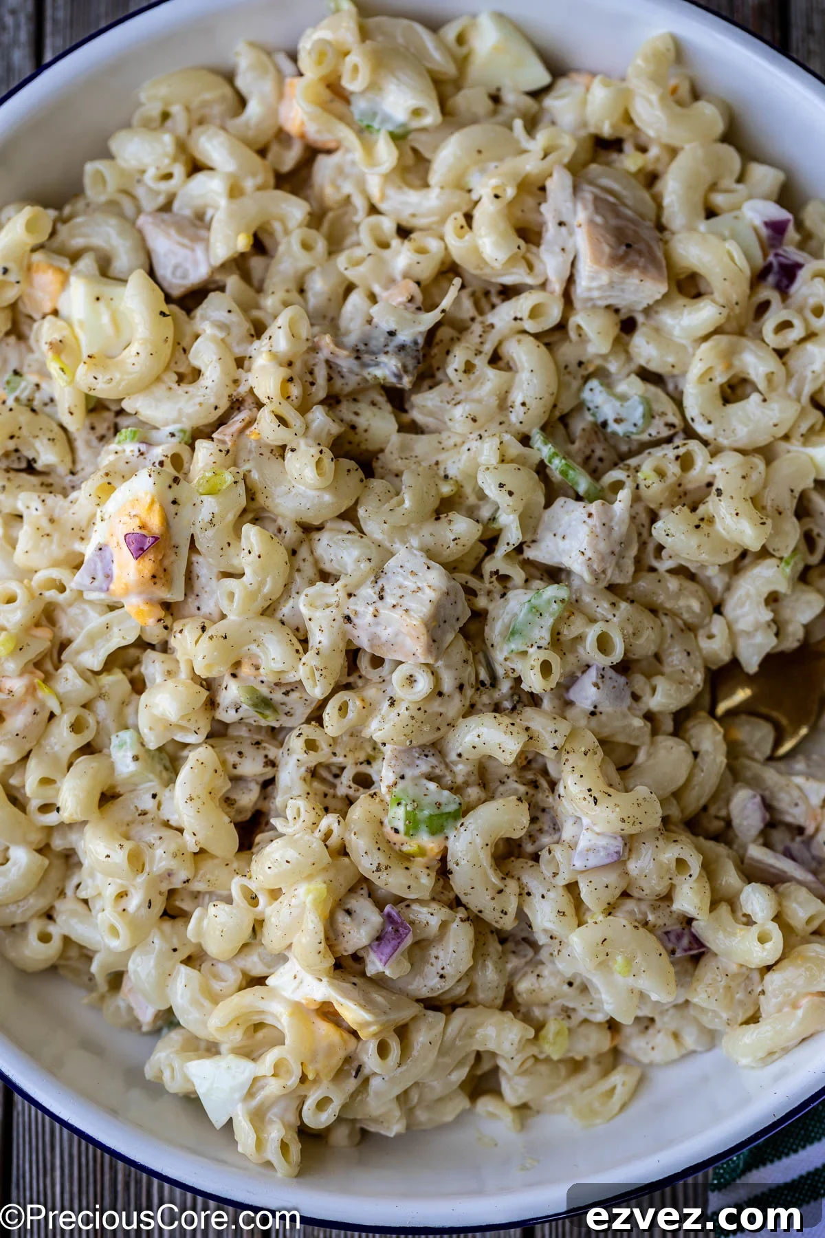 Creamy Chicken Macaroni Salad with Tangy Herb Dressing 2 ,Macaroni salad with chicken in a white bowl.