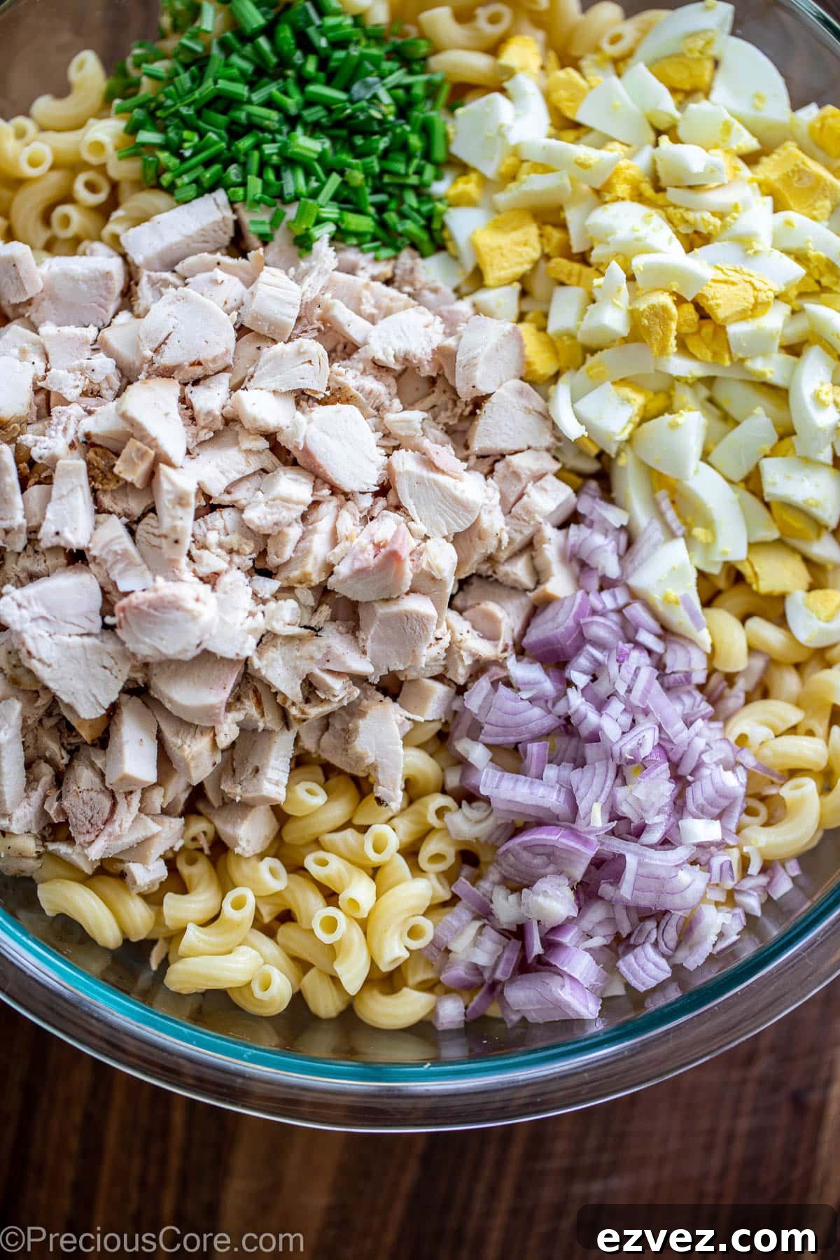 Creamy Chicken Macaroni Salad with Tangy Herb Dressing 5 Ingredients for macaroni chicken salad in a large bowl.