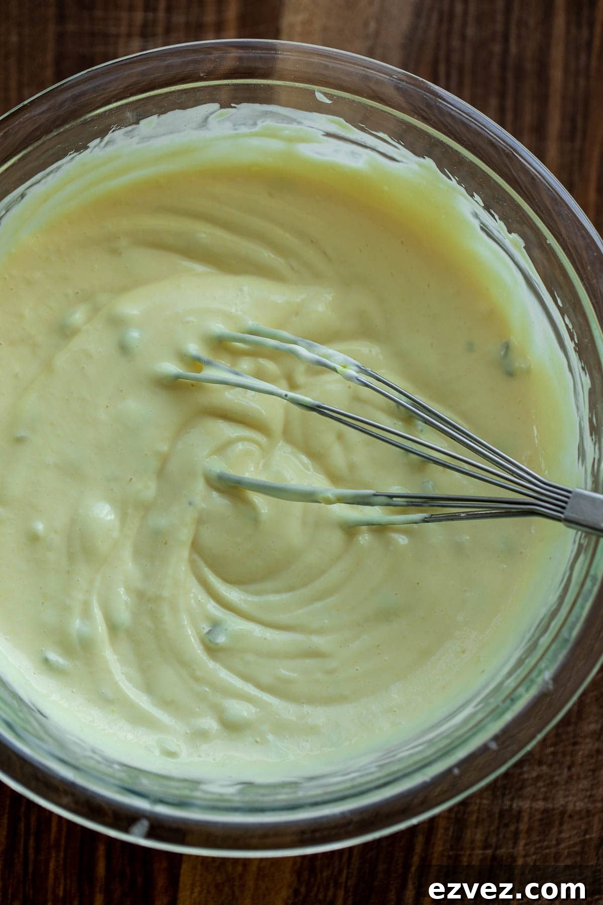 Creamy Chicken Macaroni Salad with Tangy Herb Dressing 6 Creamy dressing with a whisk in a bowl