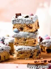 stack of mini egg cookie bars with cream cheese frosting