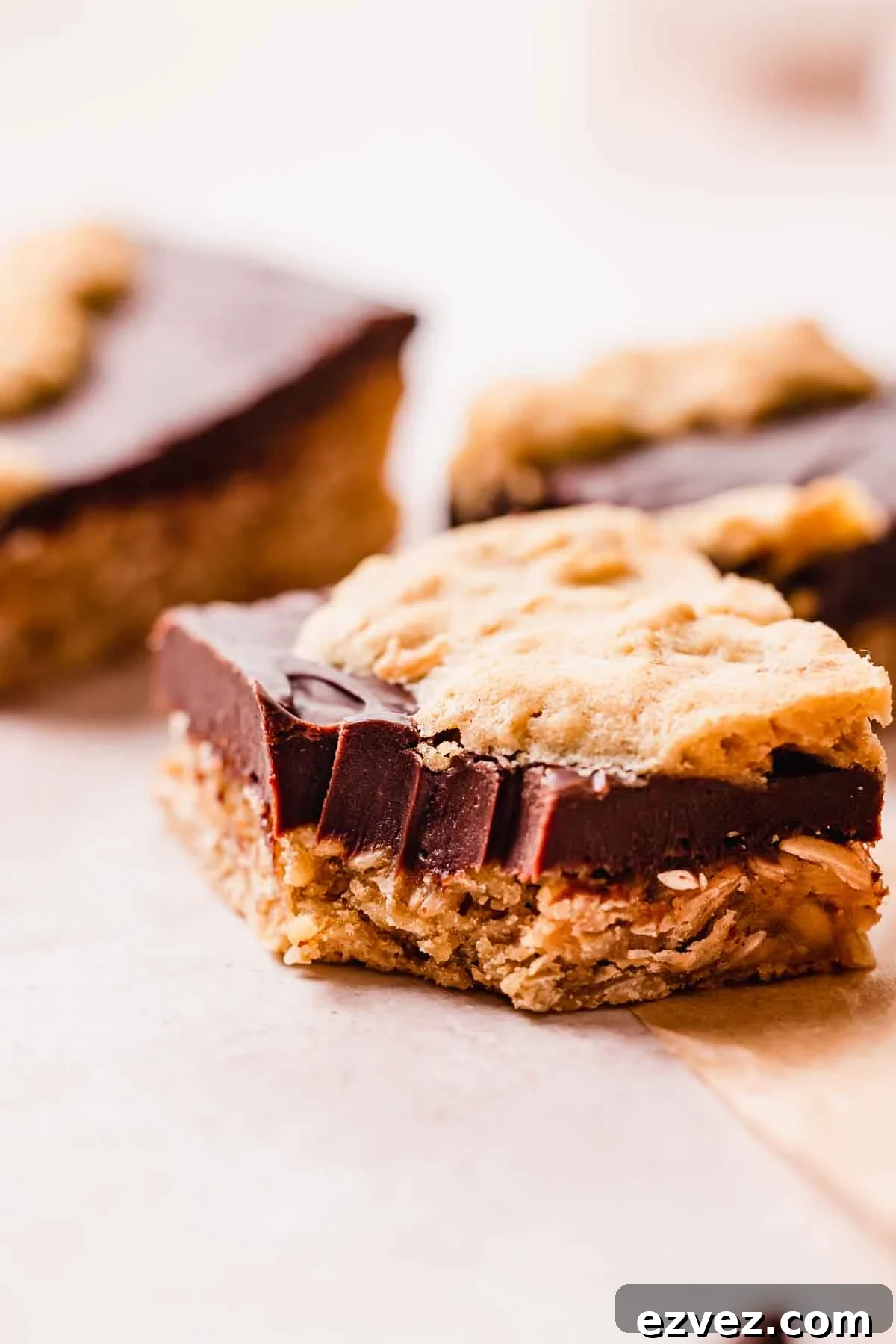 bitten oatmeal fudge bar showing smooth fudge texture