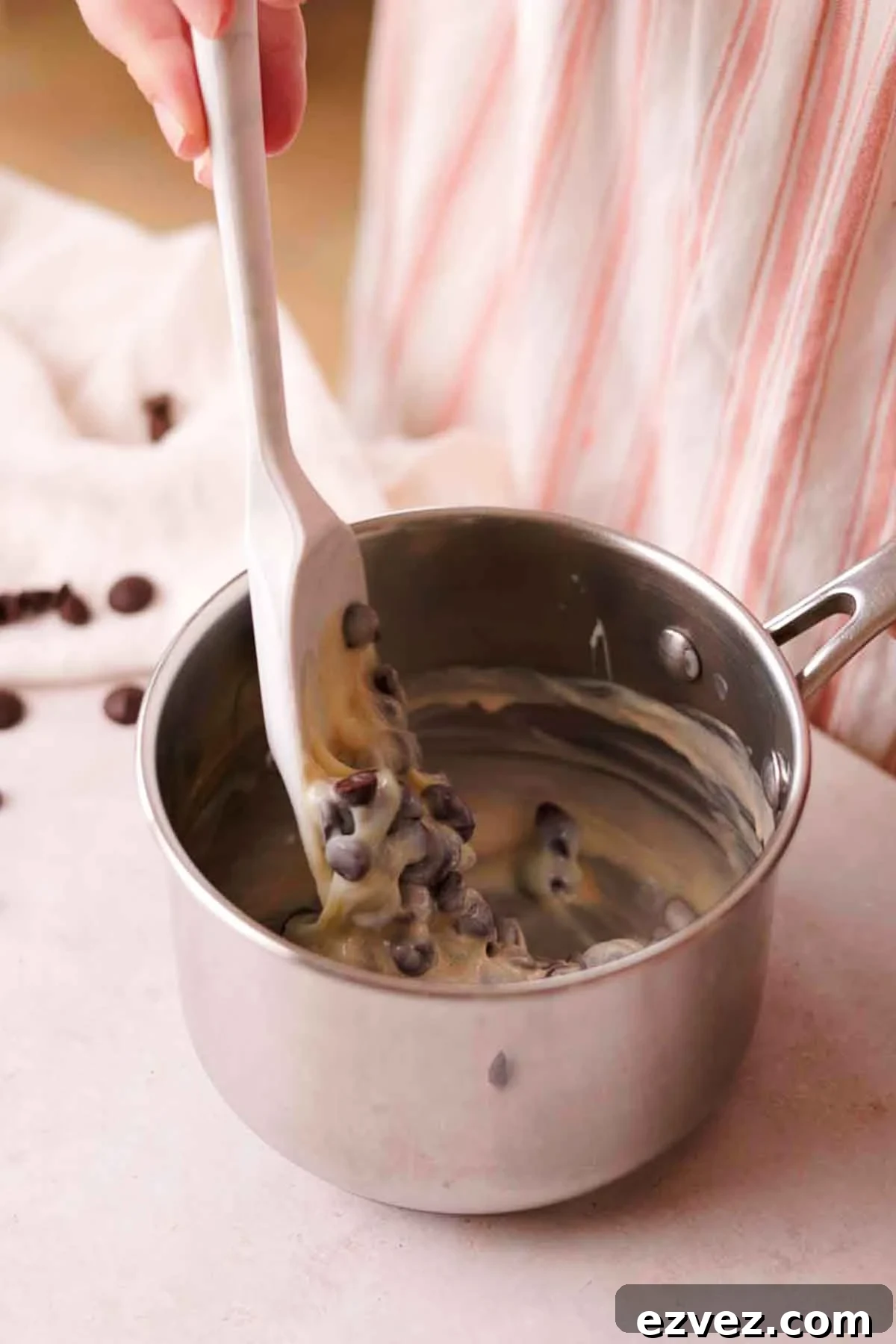 stirring chocolate fudge ingredients together in saucepan