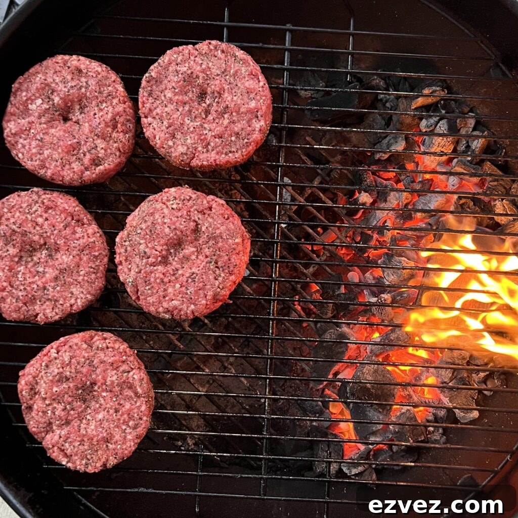 grilling burger patties on indirect side of grill.