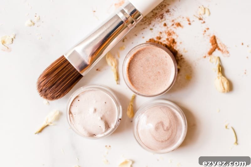3 homemade concealers in small glass jars with a fine brush applicator.