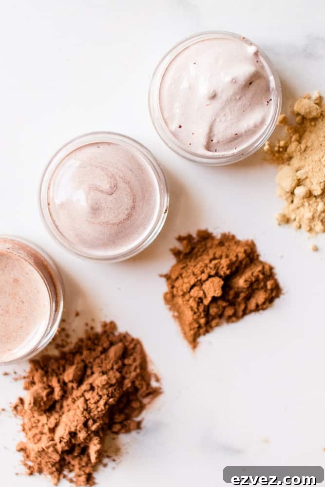 DIY concealer with extra piles of shade pigments on white marble.