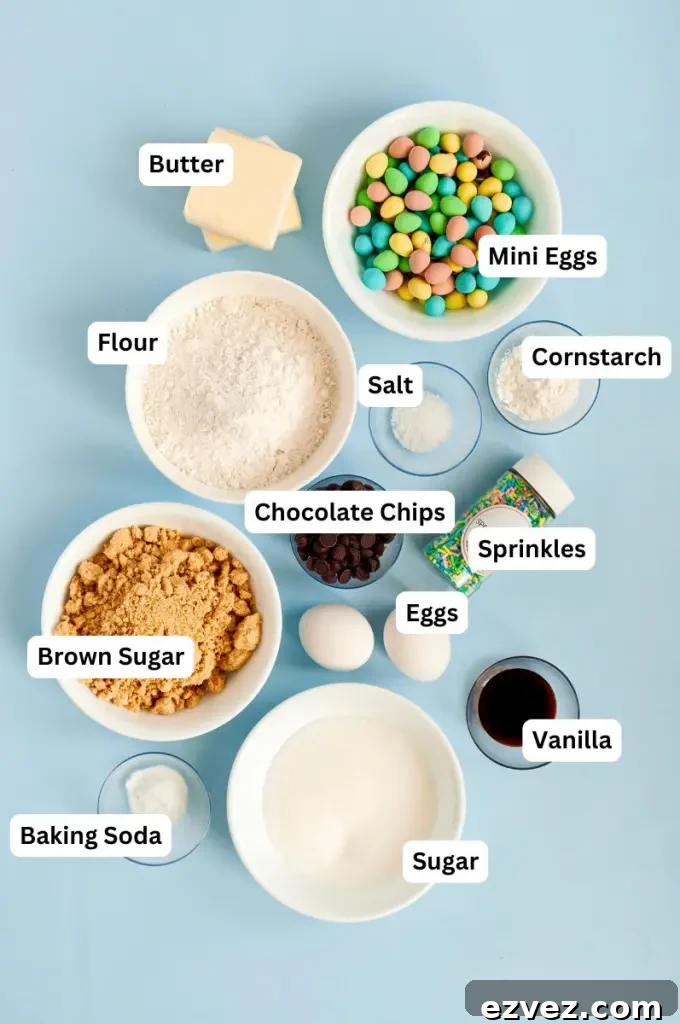 Light golden brown mini egg chocolate chip cookies full of fun pastel colored sprinkles.