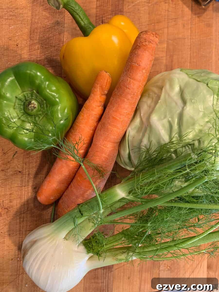 Cole slaw ingredients on a cutting board.