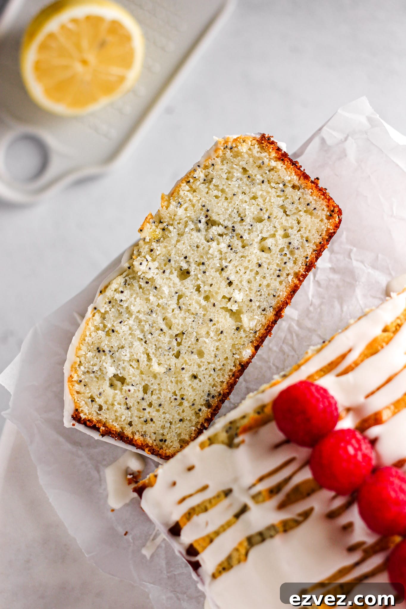 slice of lemon poppy seed pound cake with raspberries for baking blog and food photography