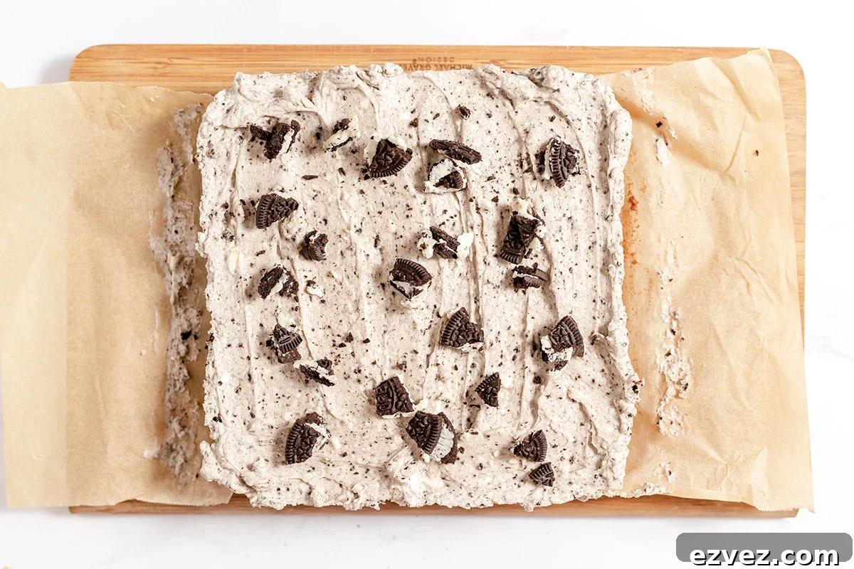 Cookies & Cream Brownies Recipe — Fudgy Oreo-Stuffed Brownies 15 Cookies and cream brownies topped with cream cheese Oreo frosting and chopped Oreos.