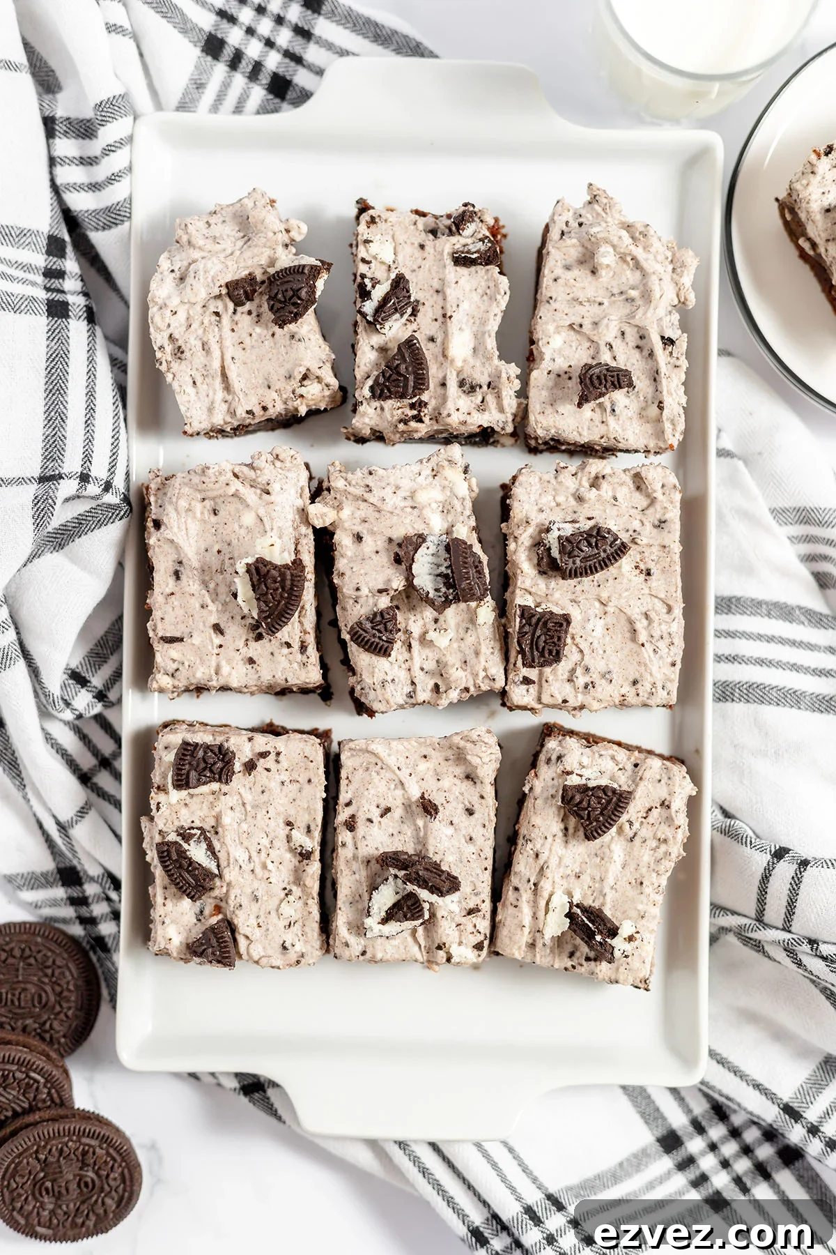 Cookies & Cream Brownies Recipe — Fudgy Oreo-Stuffed Brownies 16 Cookies and cream brownies in a white serving platter.