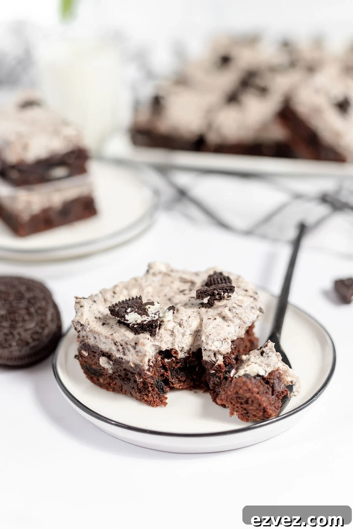 Cookies & Cream Brownies Recipe — Fudgy Oreo-Stuffed Brownies 17 Slice of Cookies and cream brownies on a plate.
