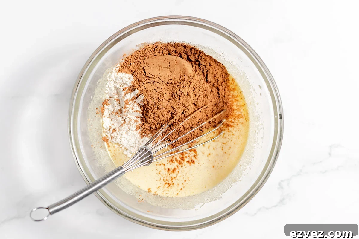 Cookies & Cream Brownies Recipe — Fudgy Oreo-Stuffed Brownies 6 Flour, cocoa, and salt added to wet ingredients in the mixing bowl