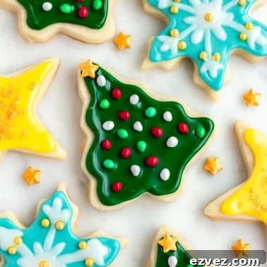 square image of laid flat vegan sugar cookies decorated with sprinkles and icing