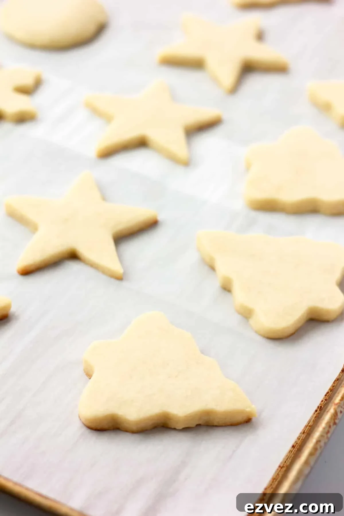 baked sugar cookies on parchment lined pan