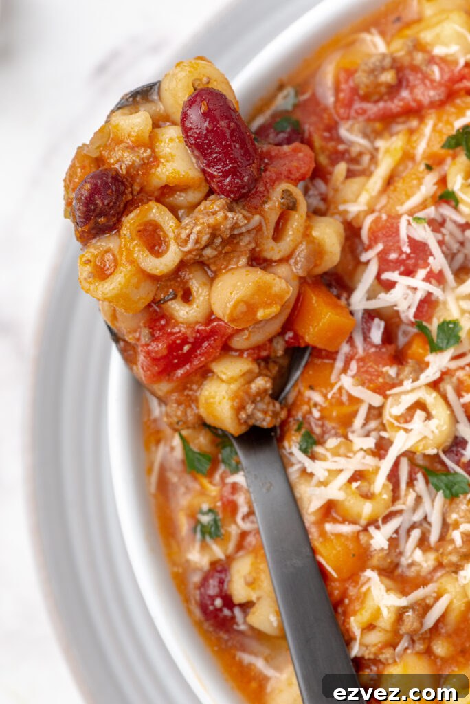 A spoonful of pasta and bean soup.