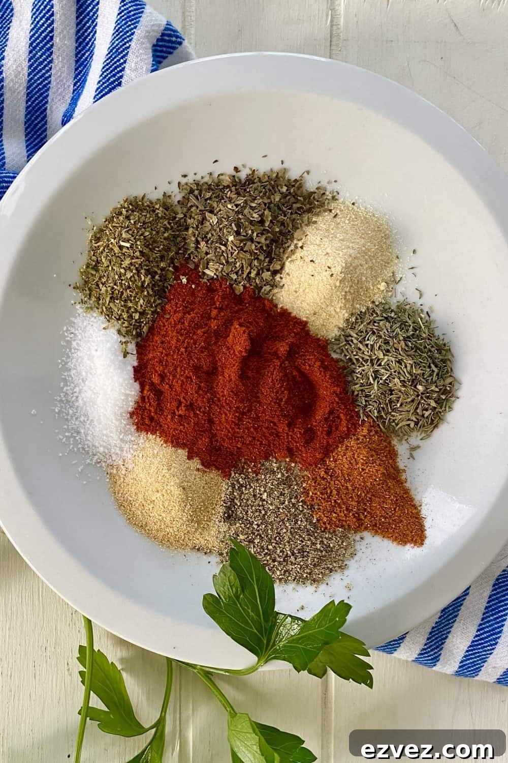 Paprika, thyme, basil, oregano, onion powder, garlic powder, cayenne pepper and pepper