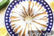 stunning lemon zucchini bundt cake served on a beautiful polish pottery plate