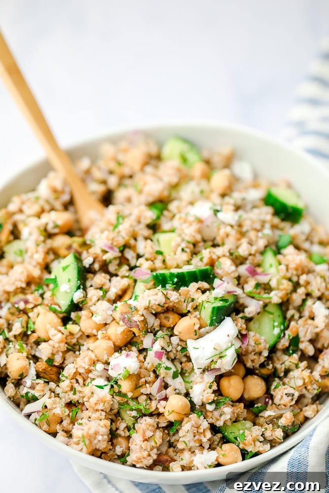 close up of a bowl of bulgur salad with cucumbers