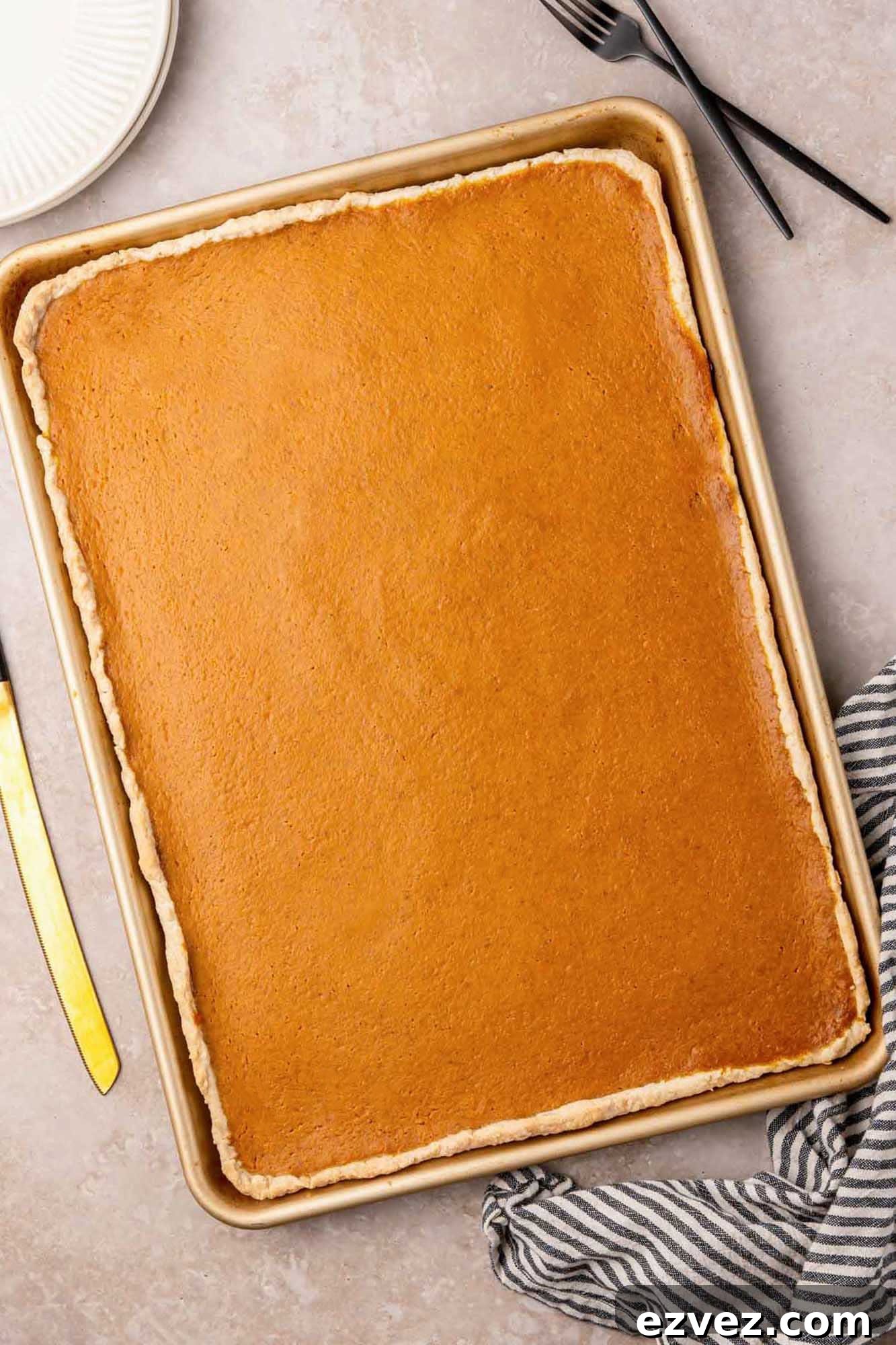 Giant Pumpkin Slab Pie Recipe for Fall Gatherings 5 Overhead shot pumpkin slab pie in a sheet pan