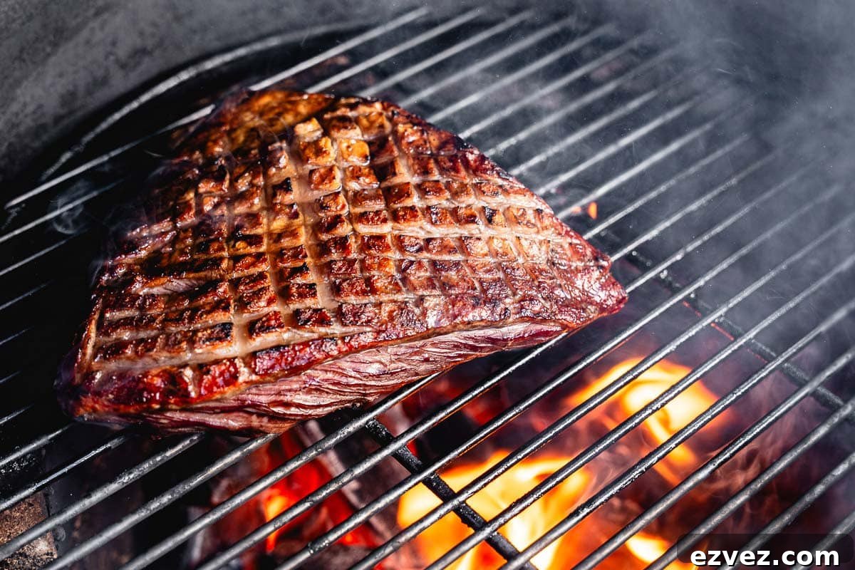 Smoked Picanha Recipe: Tender, Juicy Brazilian-Style Roast 2 searing picanha steak in charcoal grill