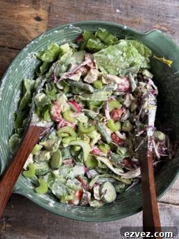a photo of sunday summer salad in a green bowl