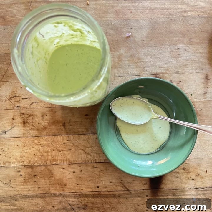 Chive Dressing in a mason jar and on small green plate with spoon