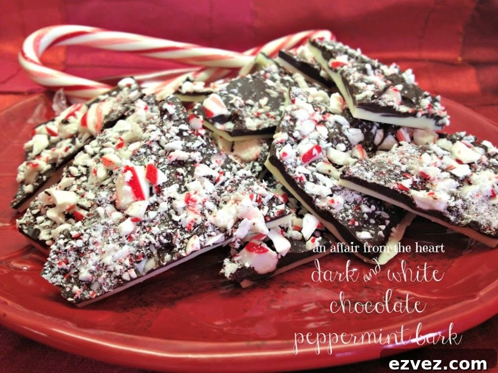 Side view of peppermint bark on a red plate with candy canes and text "dark and white chocolate peppermint bark"