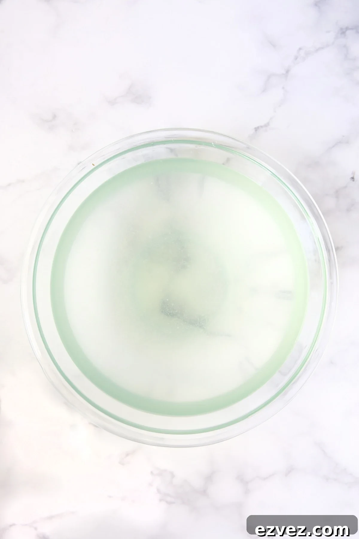 Lemon water in glass bowl.