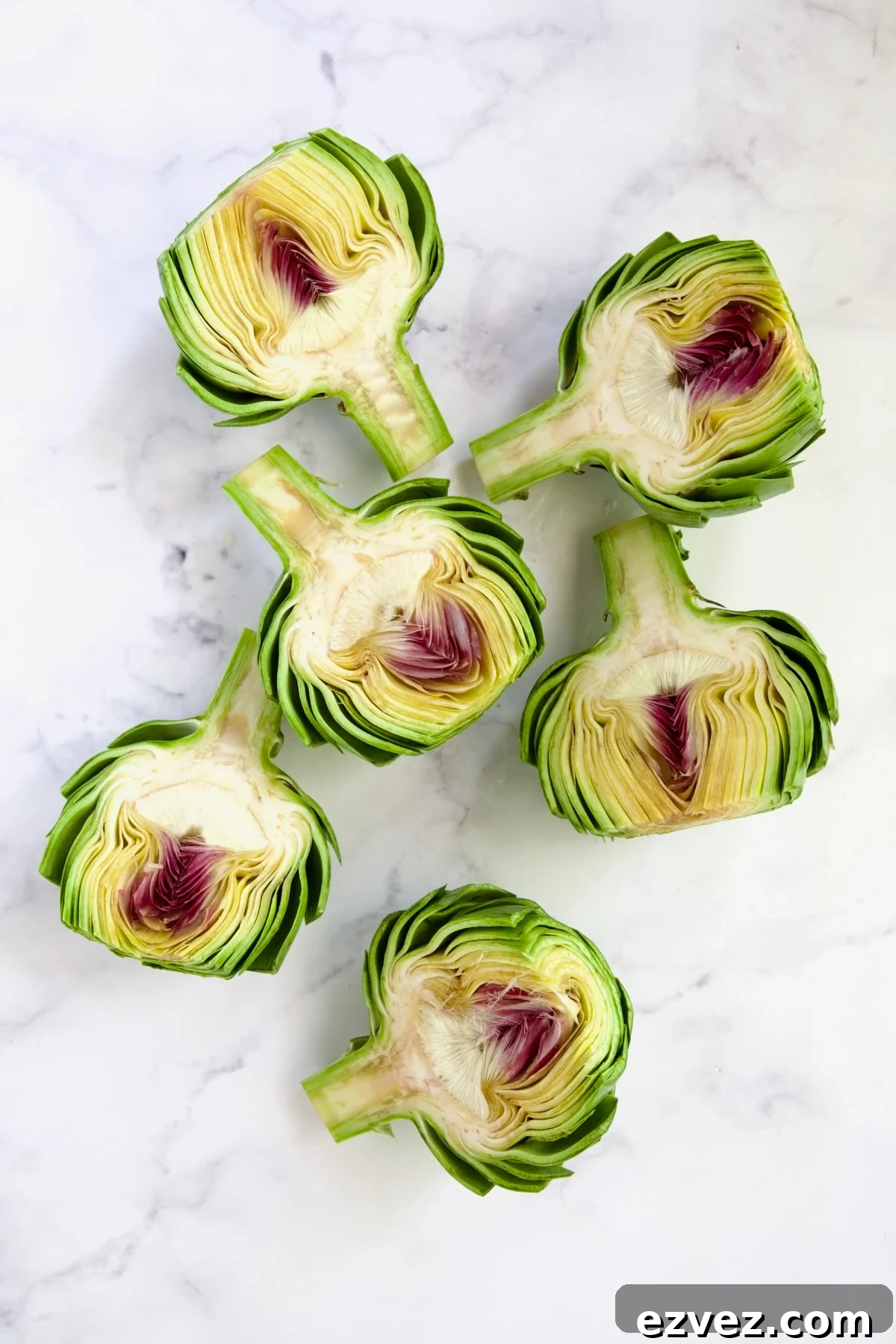 Six artichoke halves before the choke is removed.