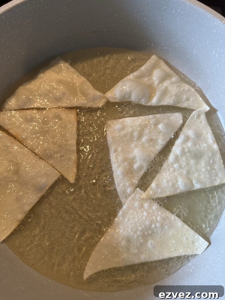 Won ton pieces pan frying in oil